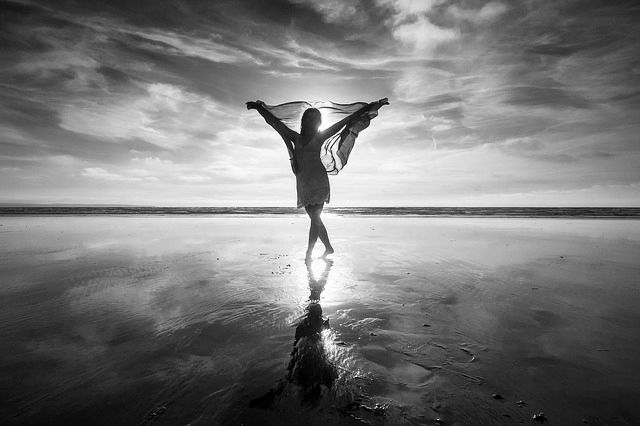 Monochrome Photo of a Woman Posing at the Beach